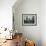 A Young Afghan Refugee Boy Stands in a Pair of Adult's Shoes-null-Framed Photographic Print displayed on a wall