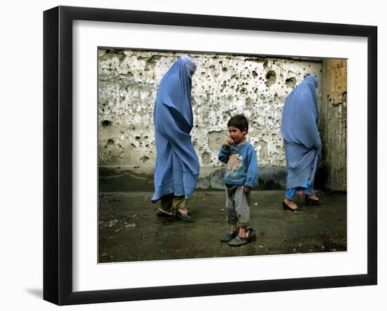 A Young Afghan Refugee Boy Stands in a Pair of Adult's Shoes-null-Framed Photographic Print