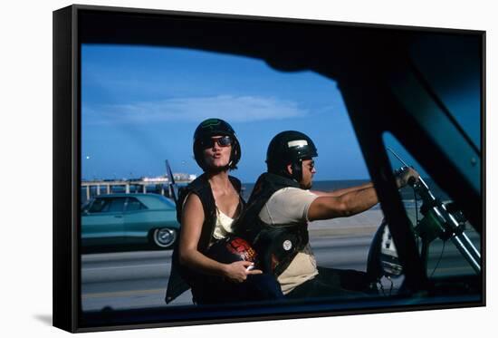 A Young Biker Sitting on the Motorbike Saddle with His Companion-Mario de Biasi-Framed Stretched Canvas