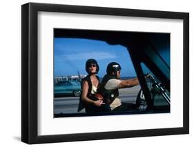 A Young Biker Sitting on the Motorbike Saddle with His Companion-Mario de Biasi-Framed Premium Photographic Print