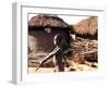 A Young Boy Carries a Hoe-null-Framed Photographic Print