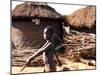 A Young Boy Carries a Hoe-null-Mounted Photographic Print