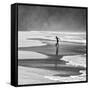 A Young Boy Kicks a Ball on Itamambuca Beach in Ubatuba, Brazil-Alex Saberi-Framed Stretched Canvas