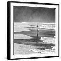 A Young Boy Kicks a Ball on Itamambuca Beach in Ubatuba, Brazil-Alex Saberi-Framed Premium Photographic Print