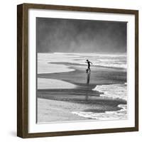 A Young Boy Kicks a Ball on Itamambuca Beach in Ubatuba, Brazil-Alex Saberi-Framed Photographic Print