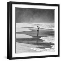 A Young Boy Kicks a Ball on Itamambuca Beach in Ubatuba, Brazil-Alex Saberi-Framed Photographic Print