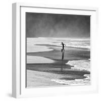 A Young Boy Kicks a Ball on Itamambuca Beach in Ubatuba, Brazil-Alex Saberi-Framed Photographic Print