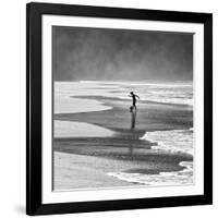 A Young Boy Kicks a Ball on Itamambuca Beach in Ubatuba, Brazil-Alex Saberi-Framed Photographic Print