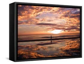 A Young Boy Takes an Early Morning Jog as the Sun Rises Along China Beach-null-Framed Stretched Canvas