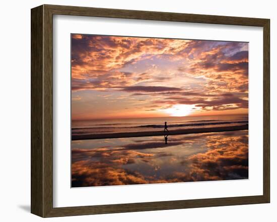 A Young Boy Takes an Early Morning Jog as the Sun Rises Along China Beach-null-Framed Premium Photographic Print