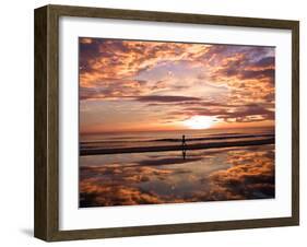 A Young Boy Takes an Early Morning Jog as the Sun Rises Along China Beach-null-Framed Premium Photographic Print