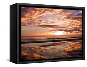 A Young Boy Takes an Early Morning Jog as the Sun Rises Along China Beach-null-Framed Stretched Canvas