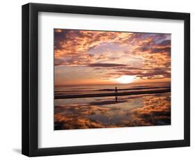 A Young Boy Takes an Early Morning Jog as the Sun Rises Along China Beach-null-Framed Photographic Print