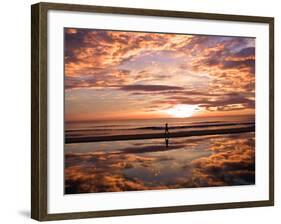 A Young Boy Takes an Early Morning Jog as the Sun Rises Along China Beach-null-Framed Photographic Print