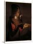 A young boy with a pipe, blowing on a firebrand-Georges De La Tour-Stretched Canvas