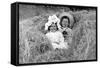 A Young Brother and Sister Nestled in the Hay, Ca. 1900-null-Framed Stretched Canvas