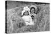 A Young Brother and Sister Nestled in the Hay, Ca. 1900-null-Stretched Canvas