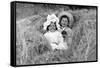 A Young Brother and Sister Nestled in the Hay, Ca. 1900-null-Framed Stretched Canvas