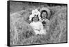 A Young Brother and Sister Nestled in the Hay, Ca. 1900-null-Framed Stretched Canvas