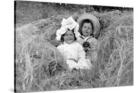 A Young Brother and Sister Nestled in the Hay, Ca. 1900-null-Stretched Canvas