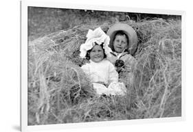 A Young Brother and Sister Nestled in the Hay, Ca. 1900-null-Framed Photographic Print