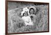 A Young Brother and Sister Nestled in the Hay, Ca. 1900-null-Framed Photographic Print