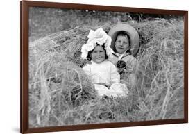 A Young Brother and Sister Nestled in the Hay, Ca. 1900-null-Framed Photographic Print