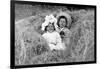 A Young Brother and Sister Nestled in the Hay, Ca. 1900-null-Framed Photographic Print