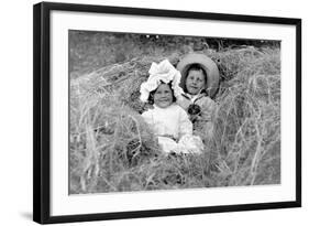 A Young Brother and Sister Nestled in the Hay, Ca. 1900-null-Framed Photographic Print