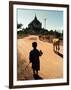 A Young Burmese Boy Tends His Family's Cows Near the Thatbinnyu Temple-null-Framed Photographic Print