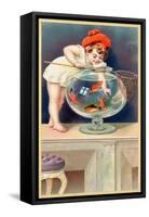 A Young Child with a Fishing Net Reaches into a Goldfish Bowl-null-Framed Stretched Canvas