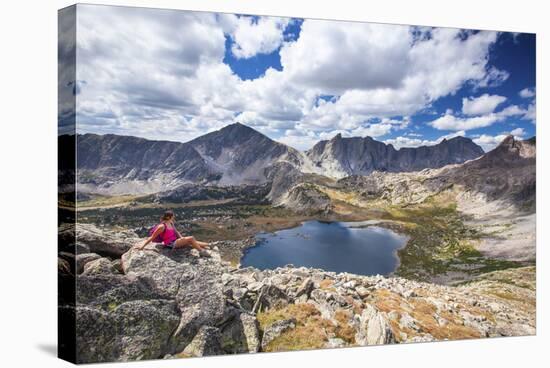 A Young Female Hiker Enjoys a Rest During a Day Hike Up Pyramid Peak, at Pyramid Lake, Wyoming-Ben Herndon-Stretched Canvas