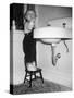 A Young Girl Brushes Her Teeth at the Sink, Ca. 1955-null-Stretched Canvas