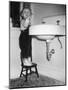 A Young Girl Brushes Her Teeth at the Sink, Ca. 1955-null-Mounted Photographic Print