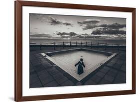 A Young Girl in an Empty Desolate Paddling Pool-Clive Nolan-Framed Photographic Print