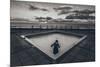 A Young Girl in an Empty Desolate Paddling Pool-Clive Nolan-Mounted Photographic Print