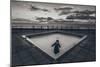 A Young Girl in an Empty Desolate Paddling Pool-Clive Nolan-Mounted Photographic Print