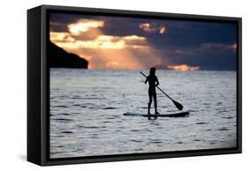 A Young Girl on a Stand Up Paddle Board on Baleia Beach at Sunset-Alex Saberi-Framed Stretched Canvas