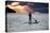 A Young Girl on a Stand Up Paddle Board on Baleia Beach at Sunset-Alex Saberi-Stretched Canvas