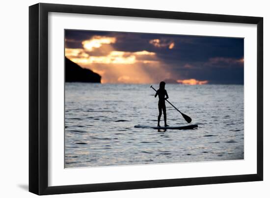 A Young Girl on a Stand Up Paddle Board on Baleia Beach at Sunset-Alex Saberi-Framed Photographic Print