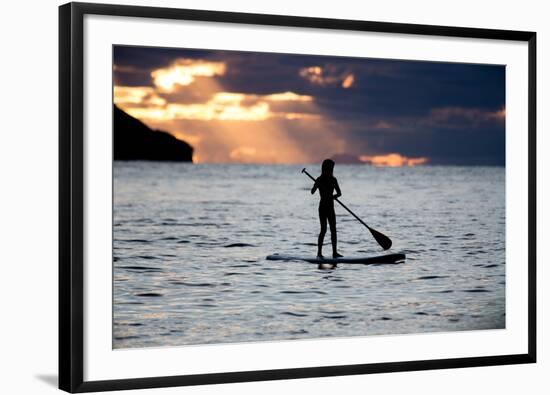 A Young Girl on a Stand Up Paddle Board on Baleia Beach at Sunset-Alex Saberi-Framed Photographic Print