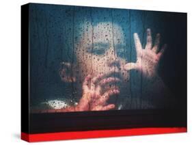 A Young Indonesian Boy Chases Raindrops on the Back Window of a Passenger Bus-null-Stretched Canvas