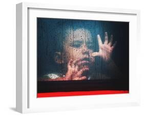 A Young Indonesian Boy Chases Raindrops on the Back Window of a Passenger Bus-null-Framed Premium Photographic Print