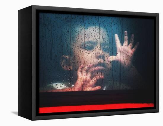 A Young Indonesian Boy Chases Raindrops on the Back Window of a Passenger Bus-null-Framed Stretched Canvas