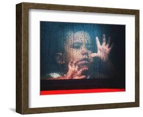 A Young Indonesian Boy Chases Raindrops on the Back Window of a Passenger Bus-null-Framed Photographic Print