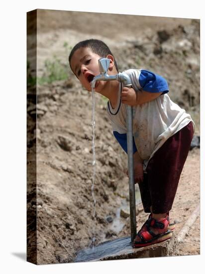 A Young Internally-Displaced Child at a Camp for Displaced Iraqis Who Have Fled Violence-null-Stretched Canvas