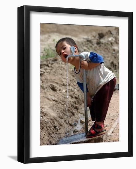 A Young Internally-Displaced Child at a Camp for Displaced Iraqis Who Have Fled Violence-null-Framed Photographic Print