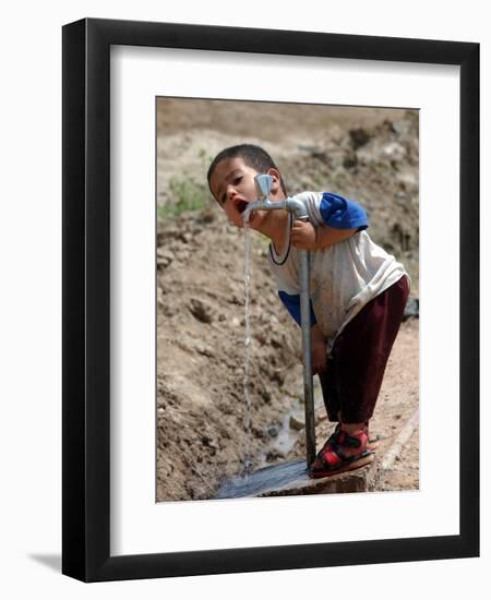 A Young Internally-Displaced Child at a Camp for Displaced Iraqis Who Have Fled Violence-null-Framed Photographic Print
