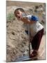 A Young Internally-Displaced Child at a Camp for Displaced Iraqis Who Have Fled Violence-null-Mounted Photographic Print