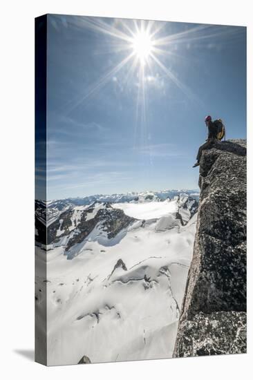 A Young Male Climber on the Summit of Pigeon Spire, Bugaboos, British Columbia-Steven Gnam-Stretched Canvas